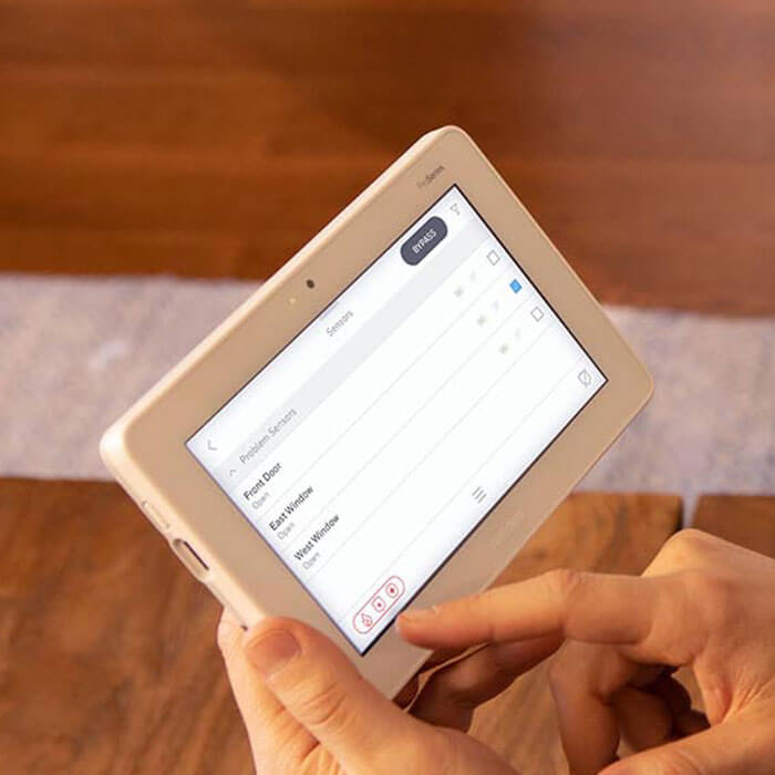 closeup of using tablet with home security app
